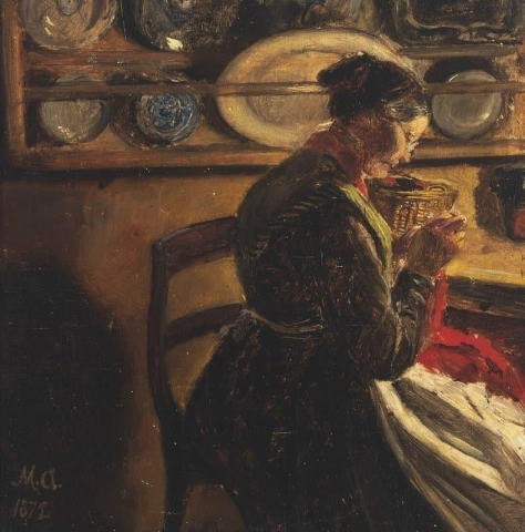 En stickande kvinna i ett kök, troligen från Kal-området 1872