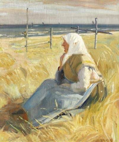 Nainen Skagenista istumassa lähellä rantaa