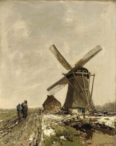 Een windmolen in een besneeuwd landschap