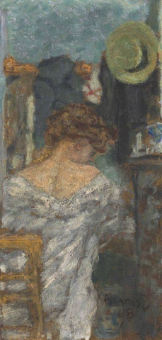 Kvinna sittande bakifrån 1898