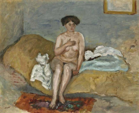 Naken kvinna sitter på en soffa 1905