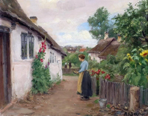 접시꽃이 있는 하얗게 칠해진 집 앞에 서 있는 젊은 여성
