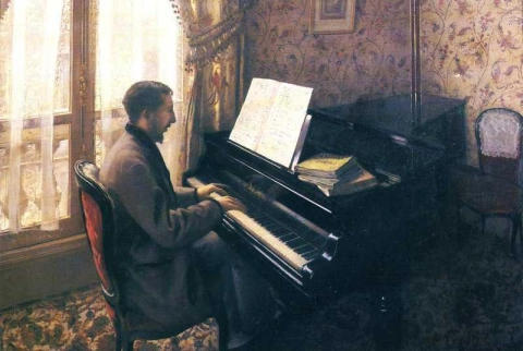 Nuori mies pianon ääressä