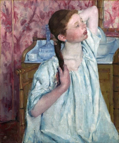 Mujer arreglando su velo hacia 1890
