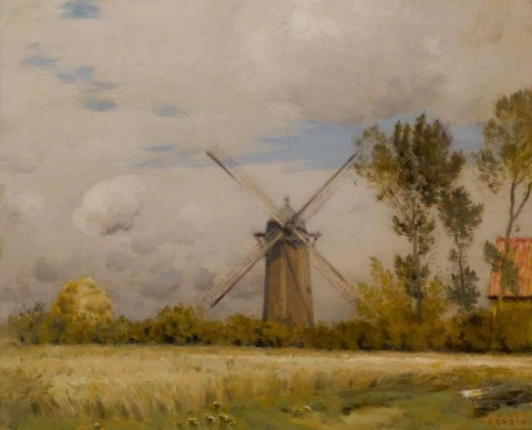 Um moinho de vento em uma paisagem de início de outono