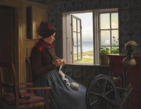 En jente fra vifte med heklet arbeid nær et åpent vindu