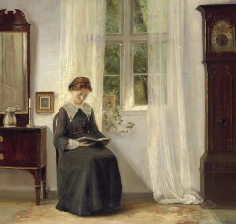 Interior con una mujer joven leyendo junto a una ventana