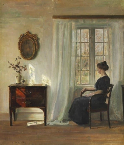 Sisustus, jossa nainen istuu ikkunan vieressä