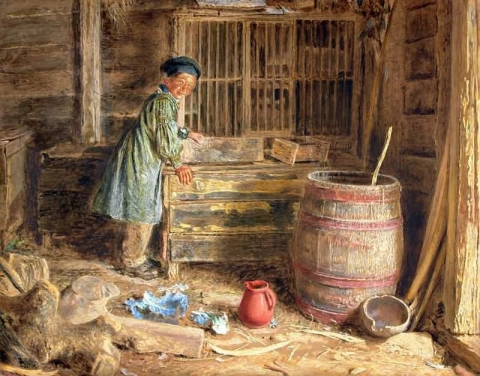 El interior de un granero con un niño de pie junto a un cofre