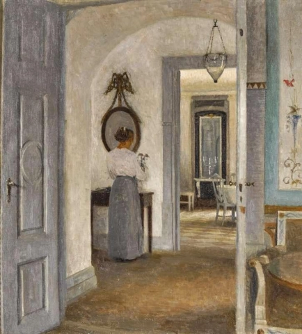 Interiør med en kvinne foran et speil Liselund 1916