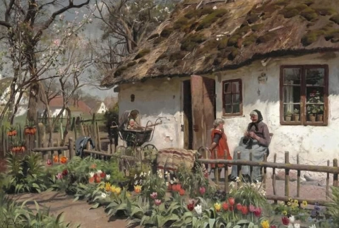 En vårdag utenfor et gårdshus med stråtak med en eldre kvinne som strikker og hennes barnebarn ved hennes side. Hagen blomstrer med en overflod av fargerike tulipaner 1915