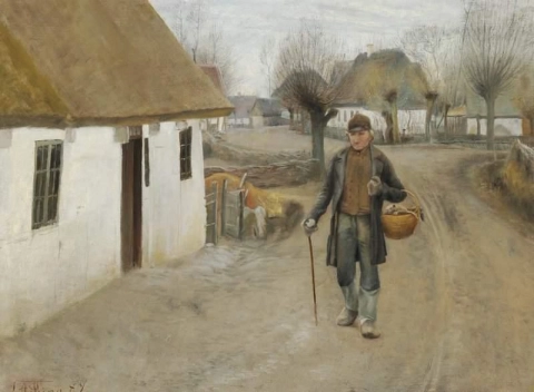 Estrada que atravessa uma vila com um homem caminhando