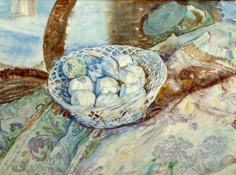 Korb mit Zwiebeln und Granatapfel auf einem Teppich. Pisa
