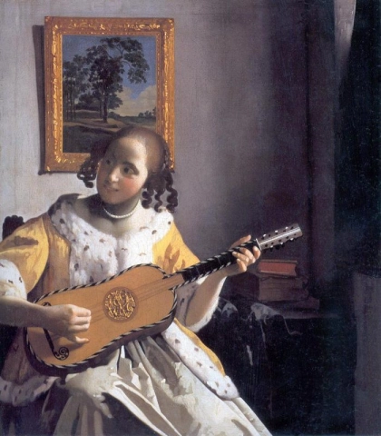 A woman playing the guitar