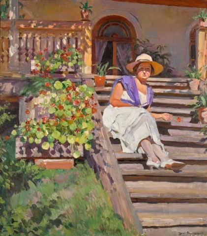 Nainen istuu portailla