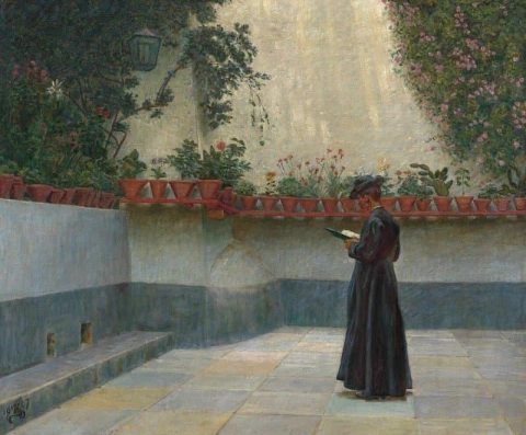 At Priest Reading. A Young Man Walking In The Square Of The Cathedral Of Amalfi. He Is Reading A Book. Potted Plants Are Placed On The Low Stone Wall Surrounding The Square