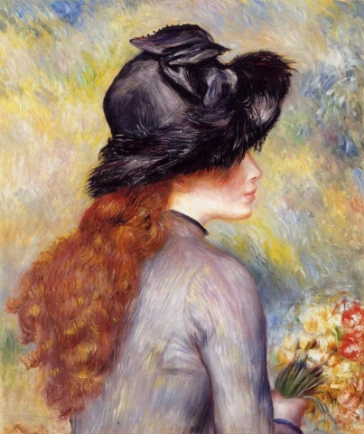 Ung kvinna som håller en bukett tulpaner