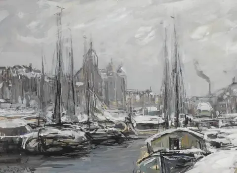 Barcos cubiertos de nieve en Amsterdam