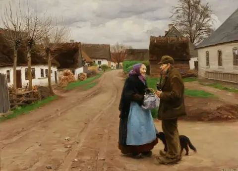 Two Elderly In Conversation In A Village