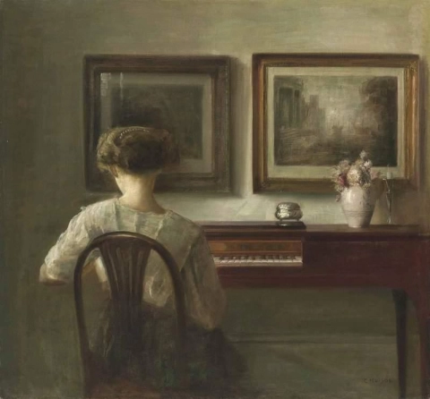 Ung dame ved spinet ca. 1900